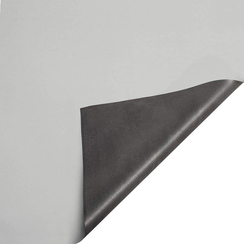 A picture of EPDM Roofing material folded over to show the white top and black bottom layers